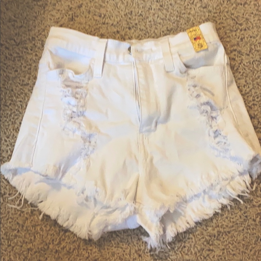 White ripped shorts